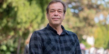 portrait of man looking at camera in park