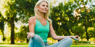 Woman meditating in park