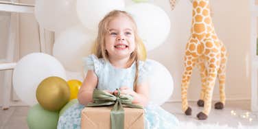 Little girl celebrating her birthday with strict gift rules