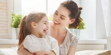 nanny and little girl laughing 