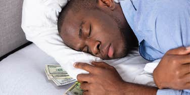 Man hiding money under his pillow is likely to struggle financially