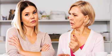 adult woman ignoring bickering mother