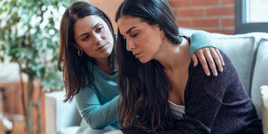 woman comforting friend in distress