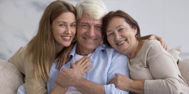 woman hugging her parents who did good job raising her