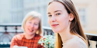 young adult woman with her mother things parents teach kids about adulthood that are actually lies