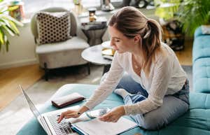 woman on laptop making a budget