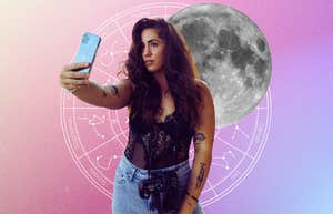 woman taking a selfie before capricorn moon
