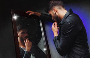 Man looking in mirror is a narcissist and here is how to tell once and for all.