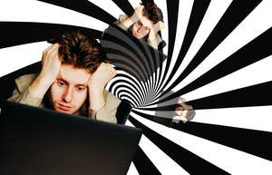 Man annoyed, going crazy staring at computer screen 