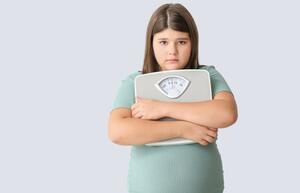 young girl worried about her weight