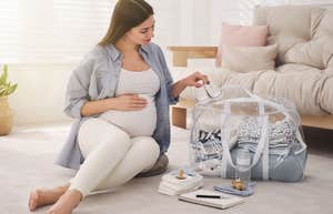 pregnant woman packing for her hospital stay