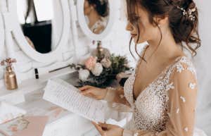 bride opening letter on her wedding day