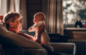 grandmother holding newborn grandkid