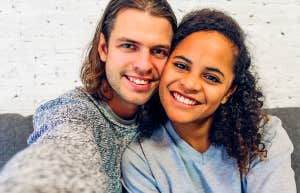 smiling couple taking photo together