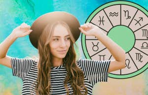 woman wearing a hat and zodiac wheel