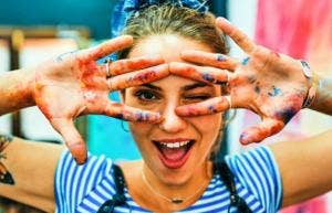 woman with paint on her hands