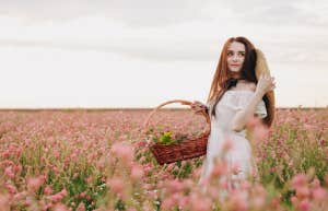 woman holding a basket in garden