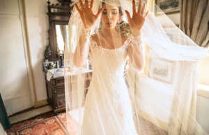 Woman in wedding dress, terrified of marriage, deep breathing